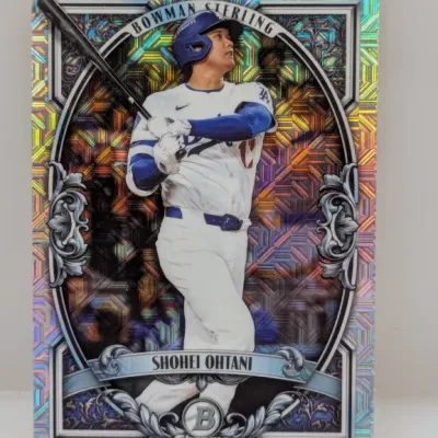 Shohei Ohtani Bowman Sterling Chrome baseball trading card featuring a colorful holographic Mojo refractor design.