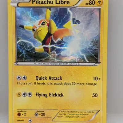 2016 Pokémon Pikachu Libre holofoil trading card, number 30/30, featuring artwork by Yoshinobu Saito in played condition.