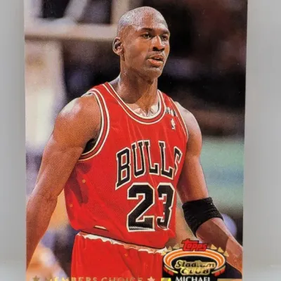 1990s Topps Stadium Club Members Choice Michael Jordan #23 basketball trading card featuring him in a red Chicago Bulls jersey.