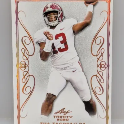 2020 Leaf Trinity Tua Tagovailoa football card featuring the player in his Alabama Crimson Tide uniform.