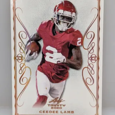 2020 Leaf Trinity CeeDee Lamb football trading card featuring an ornate metallic border.