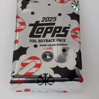 Sealed 2025 Topps Foil Buyback Pack Major League Baseball trading card pack with a holiday-themed design.