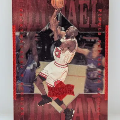 1999 Upper Deck Athlete of the Century Michael Jordan 'Records & Performances' basketball trading card. Features a deep red...