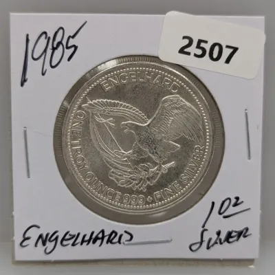 1985 Engelhard Prospector 1 troy ounce .999 fine silver round in a paper flip holder.