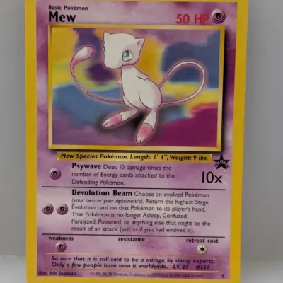 Wizards of the Coast Pokémon promo card featuring Mew (#8), circa 1999–2000. Illustrated by Ken Sugimori, the card displays slight wear...