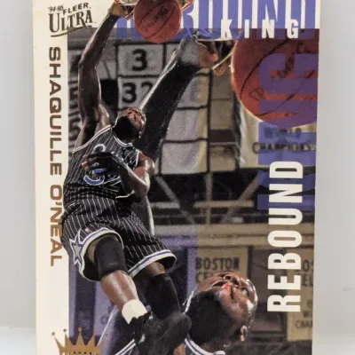 1994-95 Fleer Ultra Shaquille O'Neal Rebound King insert trading card featuring his Orlando Magic uniform.