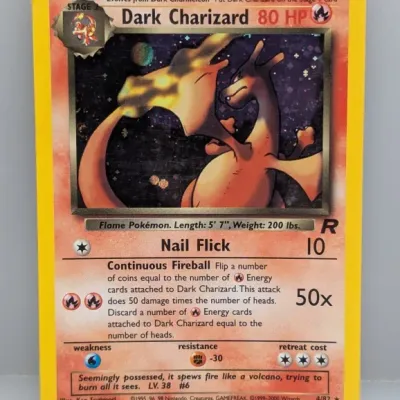 Holographic Dark Charizard Pokémon card (4/82) from the 2000 Team Rocket expansion set, illustrated by Ken Sugimori.