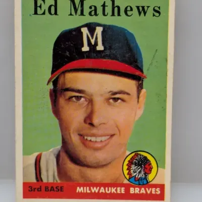 1958 Topps Ed Mathews baseball card #440 featuring the Milwaukee Braves third baseman, displaying light corner wear and good color...