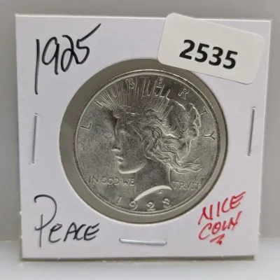 1923 Liberty Peace Silver Dollar mounted in a protective cardboard flip holder.