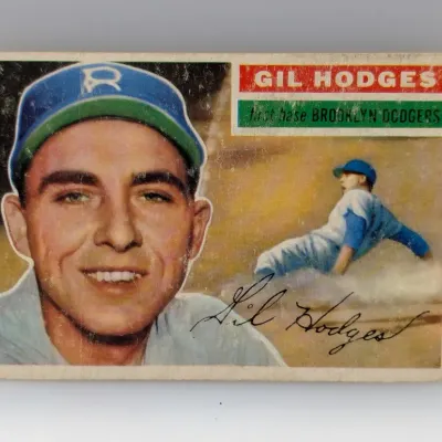 1956 Topps #145 Gil Hodges baseball card featuring the Brooklyn Dodgers first baseman, showing minor corner wear and surface scuffing.