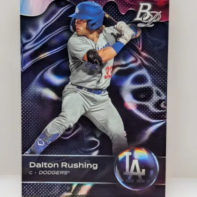 Bowman Platinum trading card featuring Dalton Rushing of the Los Angeles Dodgers, shown in excellent condition with a glossy refractor...