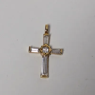 Gold-tone cross pendant featuring baguette-cut and princess-cut clear stone accents.