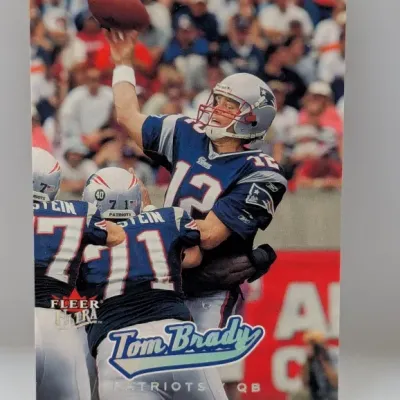 Fleer Ultra Tom Brady New England Patriots trading card in good condition, featuring a front action shot.