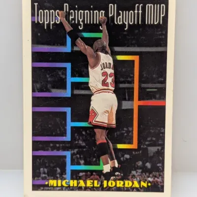 1993-94 Topps Michael Jordan "Reigning Playoff MVP" basketball card #205 featuring his arms-raised celebration.