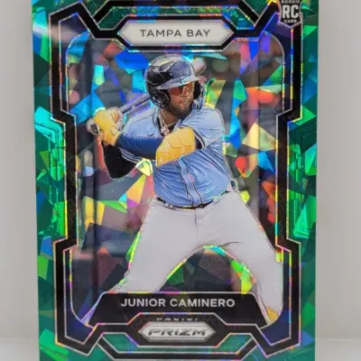 Panini Prizm Junior Caminero rookie card featuring a green ice cracked mosaic border design.
