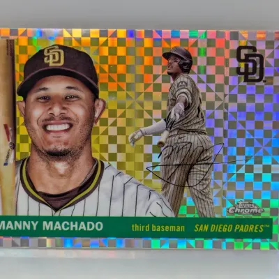 Topps Chrome Manny Machado San Diego Padres baseball trading card featuring an X-Fractor holographic foil pattern design.