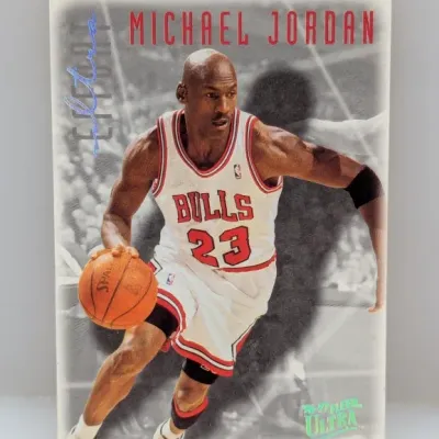 1996-97 Fleer Ultra Michael Jordan #16 trading card featuring the Chicago Bulls star dribbling in his home uniform.
