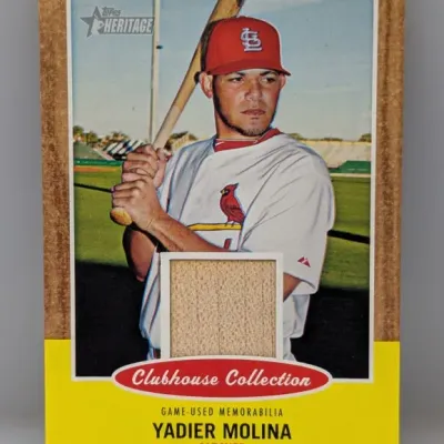Topps Heritage Clubhouse Collection Yadier Molina baseball trading card featuring an embedded game-used memorabilia bat relic.