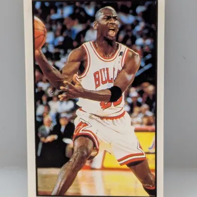 Vintage Michael Jordan Chicago Bulls trading card depicting an in-game action shot, framed by a classic white border.