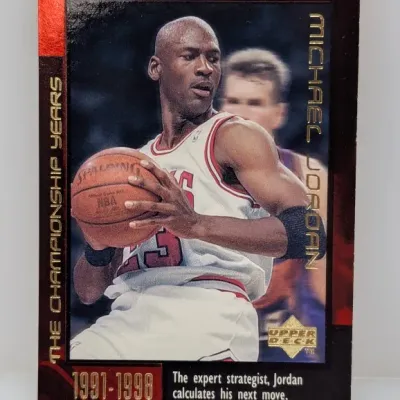 Upper Deck Michael Jordan "The Championship Years 1991-1998" basketball card, featuring gold foil lettering and black border...