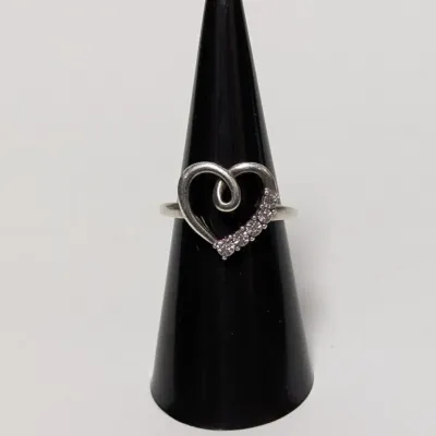 Sterling silver open heart ring with a looped swirl accent and a row of small pave cubic zirconia stones along one side.