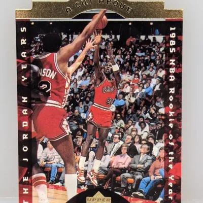 1998-99 Upper Deck 'A Cut Above' Michael Jordan insert trading card (#CA1), featuring a die-cut top header and gold foil accents.