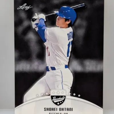 Leaf Shohei Ohtani baseball card featuring a black-and-white background with selective color highlighting his Los Angeles Dodgers uniform.