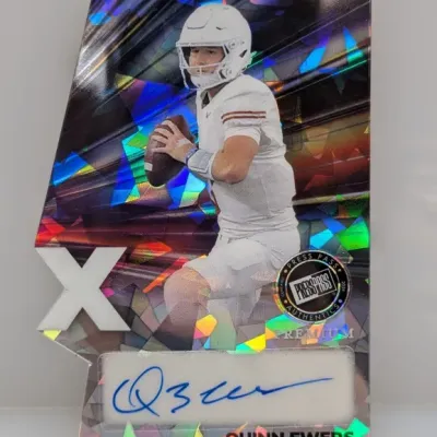 2024 Press Pass Premium Quinn Ewers die-cut autographed trading card featuring a reflective holographic geometric design.
