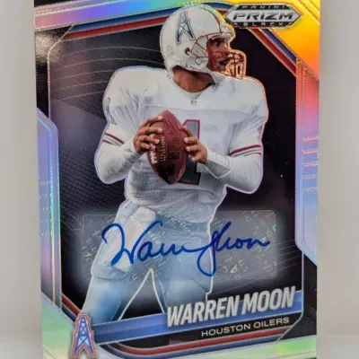 Panini Prizm Black Warren Moon autographed trading card featuring him in a Houston Oilers jersey.