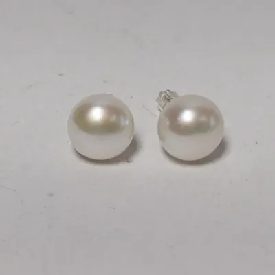 Pair of classic white cultured pearl stud earrings with friction backs.