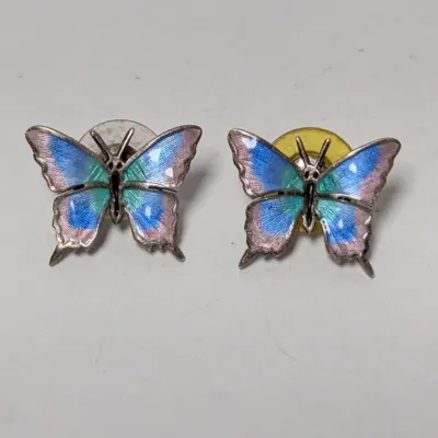 Pair of vintage silver-tone enamel butterfly post earrings featuring pastel blue, green, and pink guilloché detail.