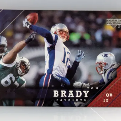 Upper Deck Tom Brady New England Patriots football trading card featuring in-game action photography.