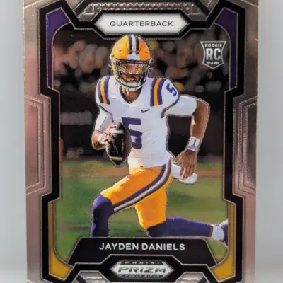 Panini Prizm Draft Picks Jayden Daniels rookie card featuring him in his LSU Tigers uniform.