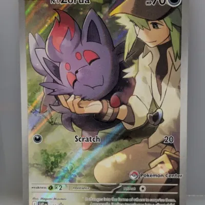 Pokémon TCG N's Zorua full-art promo card (SVP EN 189) featuring Pokémon Center stamp, in excellent condition.