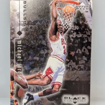 1997-98 Upper Deck Black Diamond Michael Jordan trading card featuring a action photograph of him dunking for the Chicago Bulls.