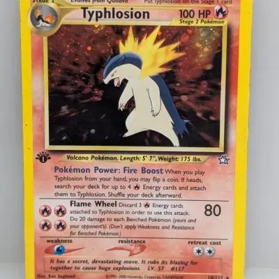 1st Edition Typhlosion holographic Pokémon card (#18/111) from the 2000 Neo Genesis set, featuring artwork by Ken Sugimori.