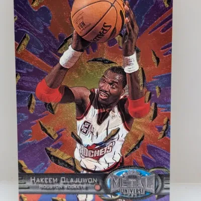 1997-98 Fleer Metal Universe Hakeem Olajuwon basketball trading card #45 in good condition.