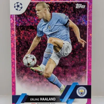 Topps UEFA Champions League Erling Haaland trading card featuring a magenta glitter parallel border, in excellent condition.