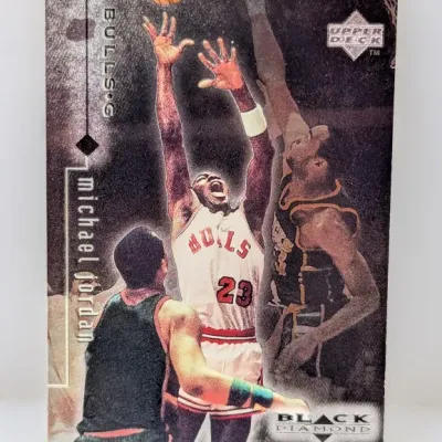 1990s Upper Deck Black Diamond Michael Jordan #23 basketball trading card featuring an in-game action photo.