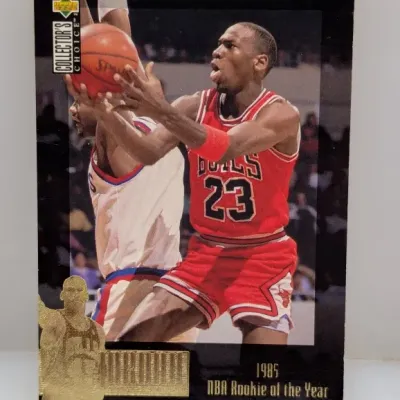 Upper Deck Collector's Choice Michael Jordan 1985 NBA Rookie of the Year trading card, featuring a gold foil embossed seal on the...
