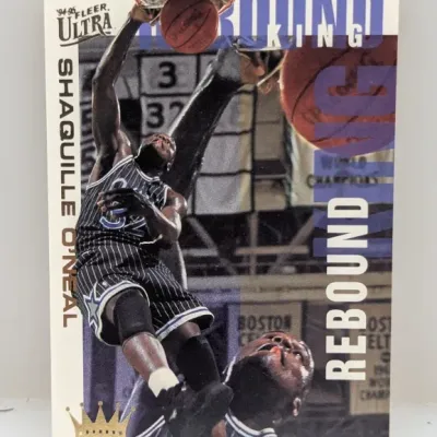 1994-95 Fleer Ultra Rebound King Shaquille O'Neal basketball card #5 featuring a metallic foil crown design and Action shot of...