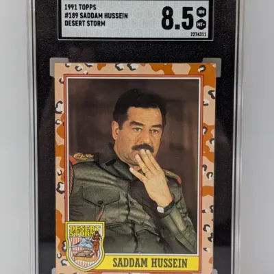 SGC-graded 8.5 NM/MT+ 1991 Topps Desert Storm trading card, #189 Saddam Hussein, housed in a protective slab.