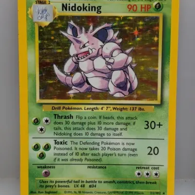 1999 Pokémon Base Set Nidoking holographic trading card (11/102), illustrated by Ken Sugimori.