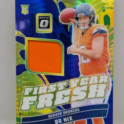 Donruss Optic Bo Nix First Year Fresh rookie card featuring an embedded orange jersey relic patch.