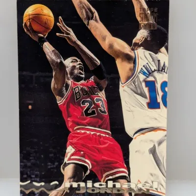 1992-93 Topps Stadium Club Michael Jordan #1 basketball trading card featuring an action shot of Jordan driving to the hoop in his...