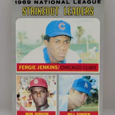 1970 Topps #70 1969 National League Strikeout Leaders baseball card featuring Fergie Jenkins, Bob Gibson, and Bill Singer.