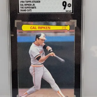 SGC-graded 9 Mint 1984 Topps Sticker Cal Ripken Jr. The Super Bats hand-cut card encased in a protective slab.