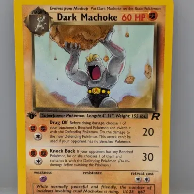 1st Edition Dark Machoke #40/82 Pokémon card from the 2000 Team Rocket expansion set, illustrated by Mitsuhiro Arita.