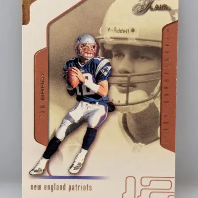 2002 Fleer Flair Tom Brady New England Patriots trading card, featuring a dual action and portrait design.
