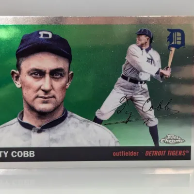 Topps Chrome Ty Cobb baseball card with a green refractor-style finish, featuring a portrait and action shot of the Detroit Tigers...